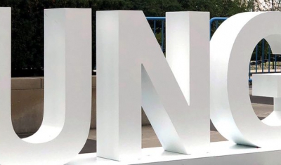 A sign outside of the General Assembly building highlights the hash tag for attendees to use to promote the seventy-third session's debate.