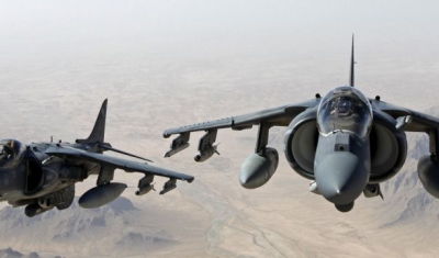 AV-8B Harrier jets with Marine Attack Squadron 311 fly over Helmand province, Afghanistan, June 10, 2013