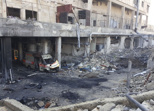 Syria, destroyed building and ambulance