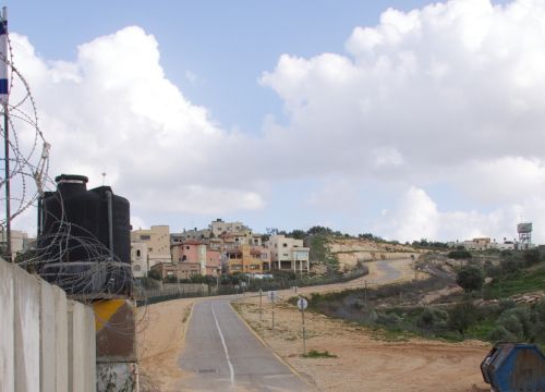 West Bank, Qalqilya, enclaved village of Azun Atme. Azun Atme check-point and West Bank barrier between Beit Amin and the settlement of Sha'arei Tikva