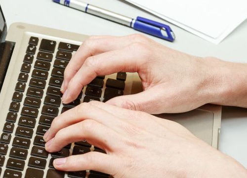 Student taking notes