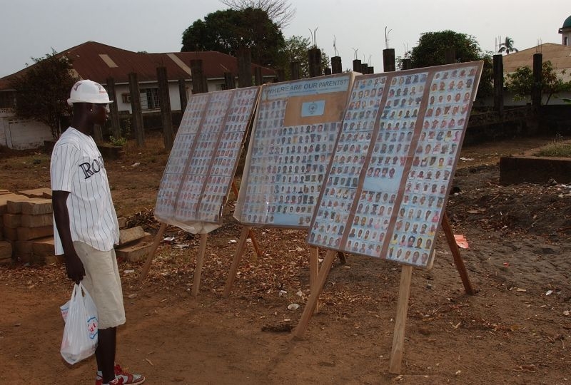 Board with photos of disappeared persons